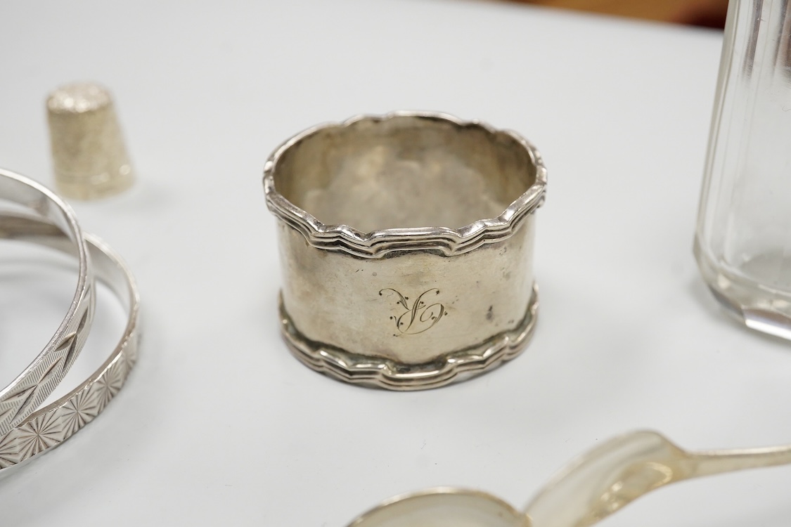 A collection of small silver to include a cigarette case, two napkin rings, three pairs of sugar tongs, a thimble, a lady's wrist watch and a mounted glass toilet jar. together with a 925 fob watch, a 935 mounted lighter
